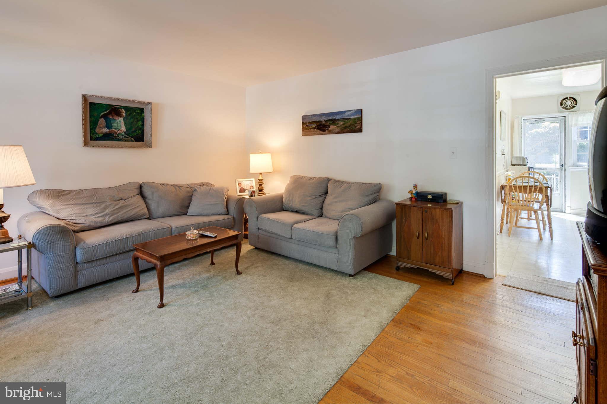 342 Greenlow Road Baltimore, MD 21228 - Photo 13 of 28 a living room with furniture and a wooden floor
