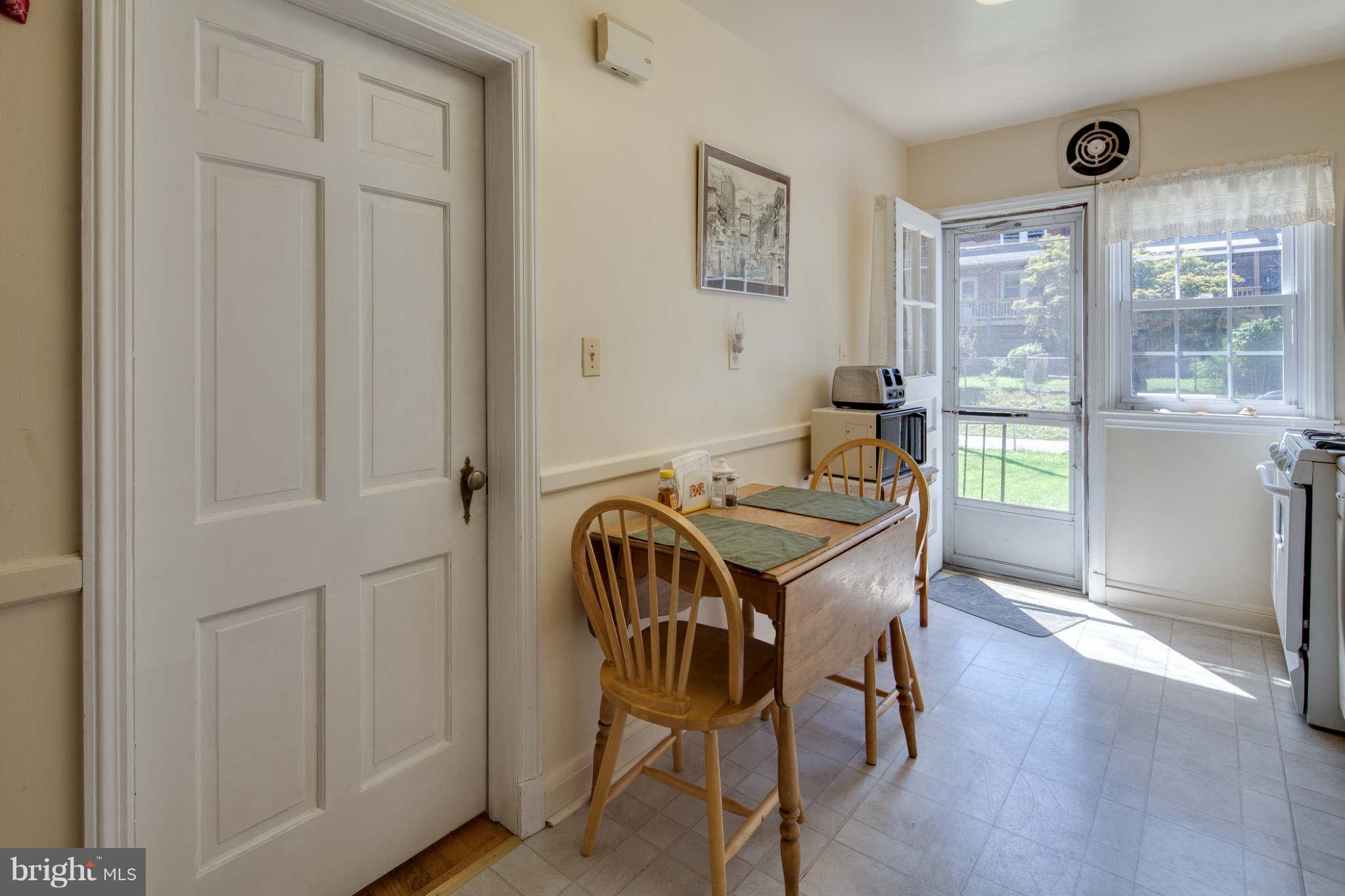 342 Greenlow Road Baltimore, MD 21228 - Photo 15 of 28 a view of a dining room with furniture window and wooden floor