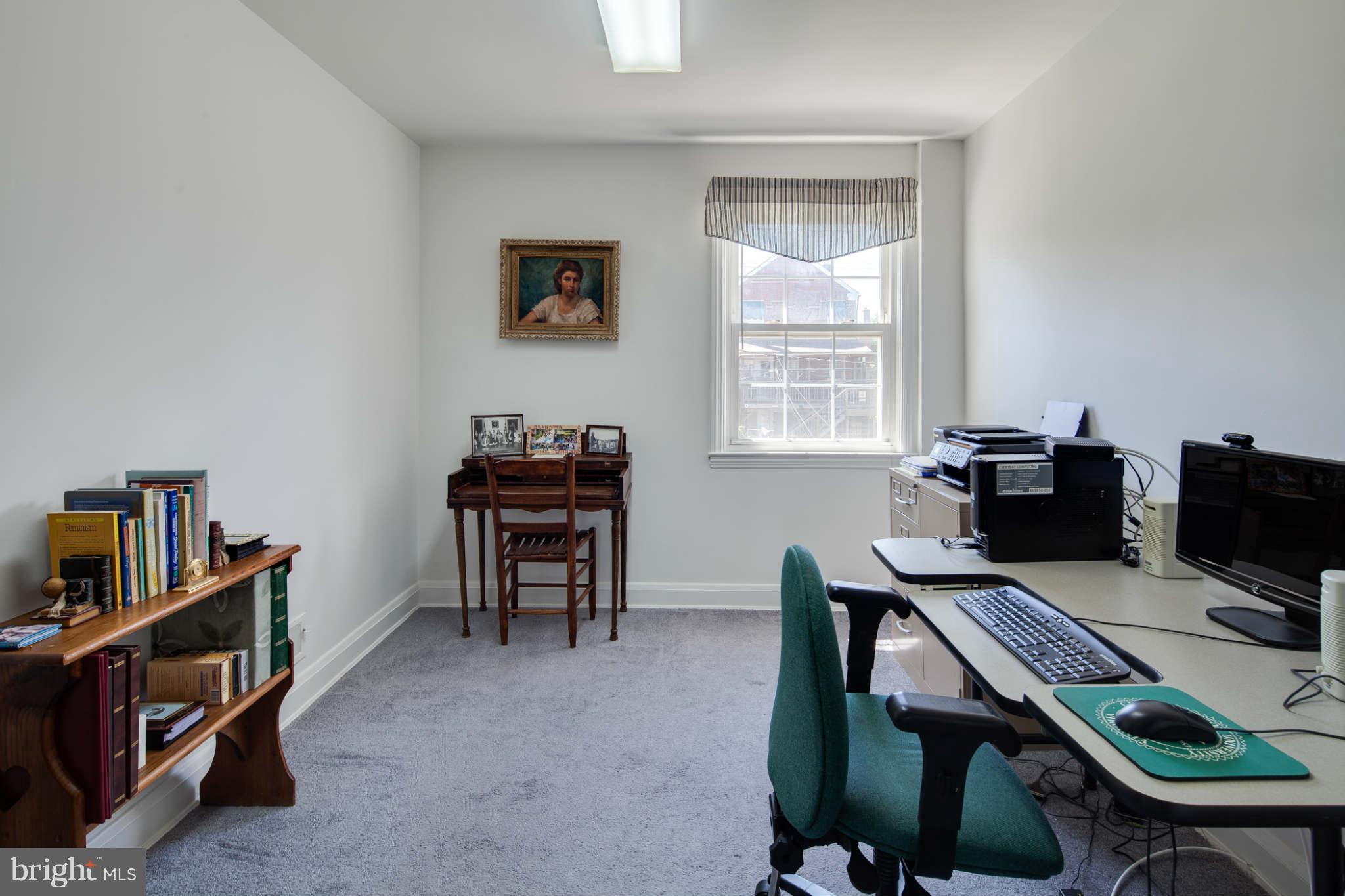 342 Greenlow Road Baltimore, MD 21228 - Photo 21 of 28 a view of a workspace with furniture and a window