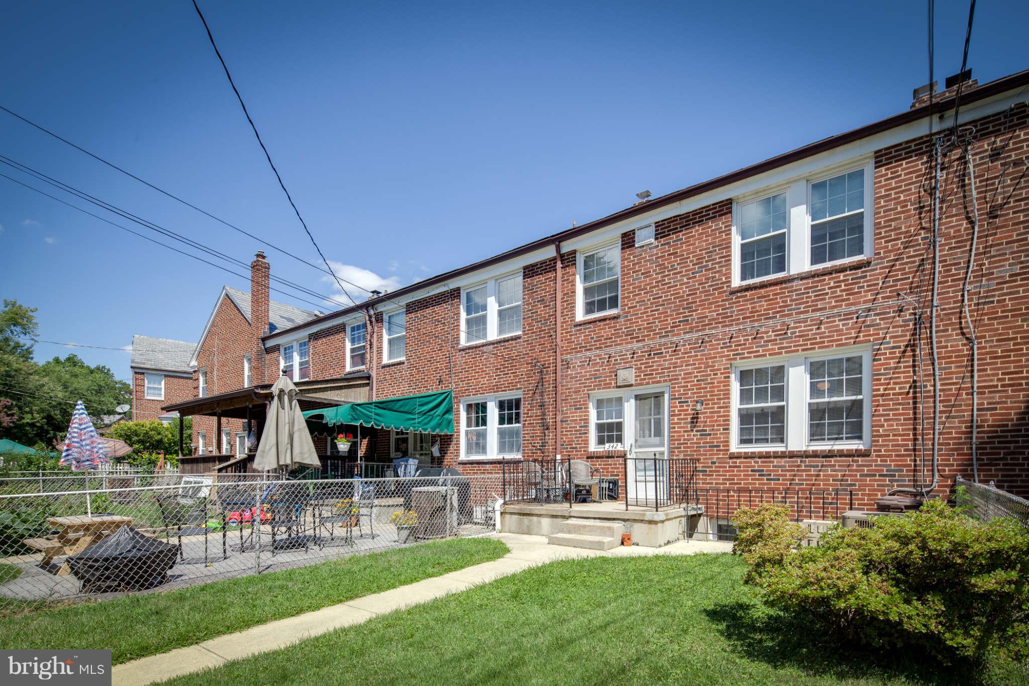 342 Greenlow Road Baltimore, MD 21228 - Photo 27 of 28 a front view of a house with a yard fire pit and outdoor seating