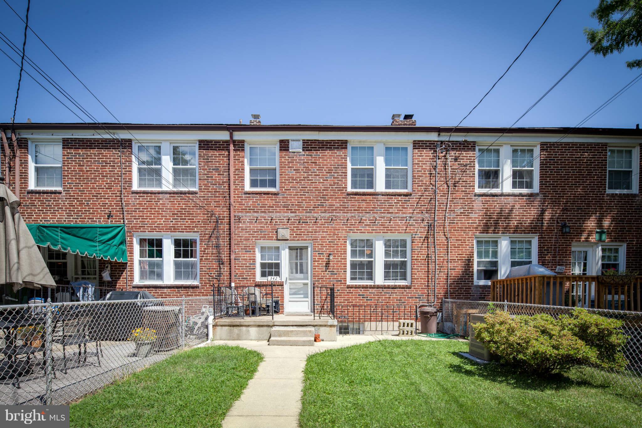 342 Greenlow Road Baltimore, MD 21228 - Photo 4 of 28 a front view of a house with a yard