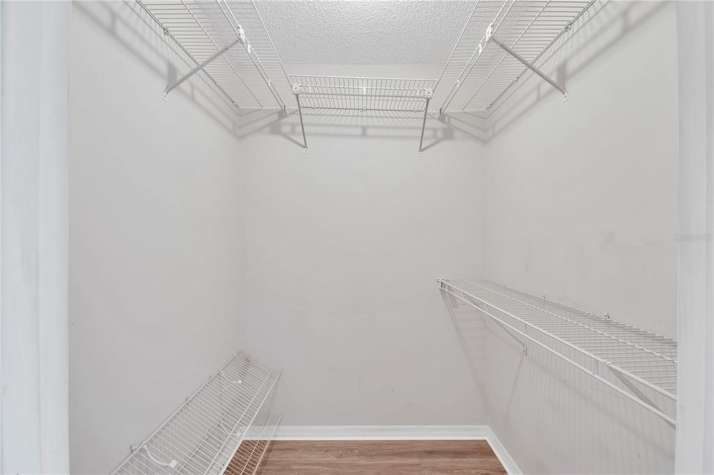 6366 Southwest 115th Street Road Ocala, FL 34476 - Photo 16 of 45 a view of walk in closet with empty racks