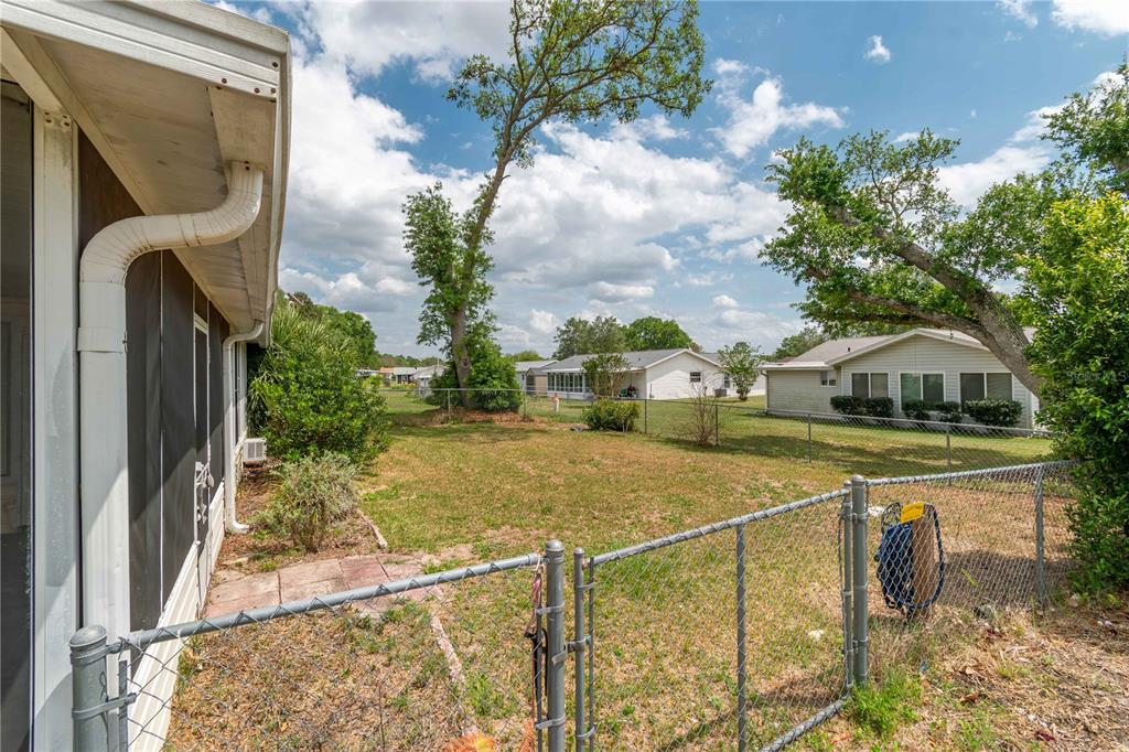 6366 Southwest 115th Street Road Ocala, FL 34476 - Photo 36 of 45 a view of a house with a backyard