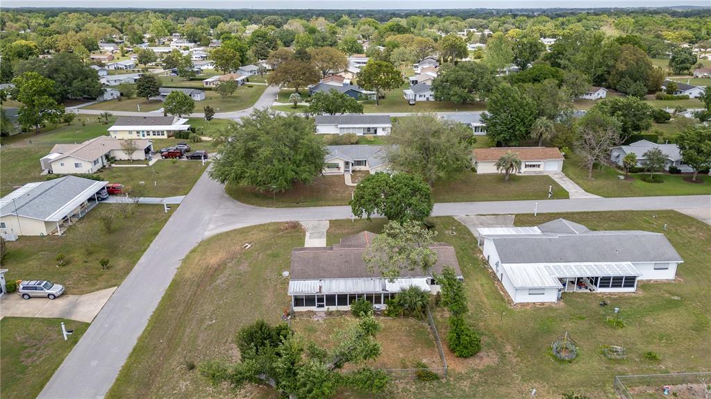 6366 Southwest 115th Street Road Ocala, FL 34476 - Photo 42 of 45 an aerial view of residential houses with outdoor space