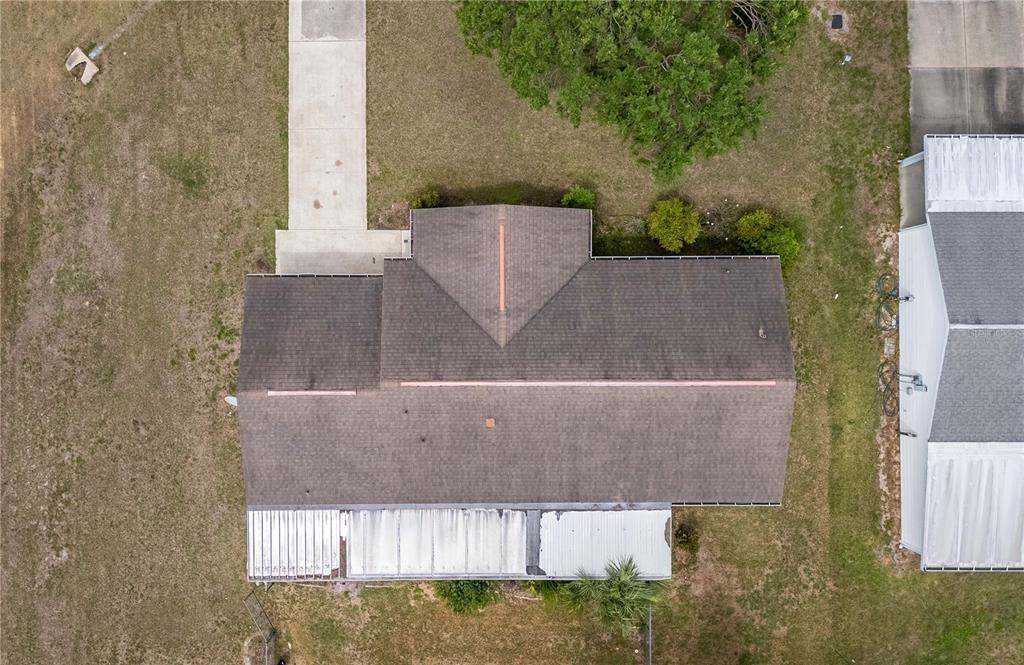 6366 Southwest 115th Street Road Ocala, FL 34476 - Photo 44 of 45 an aerial view of a house with outdoor space