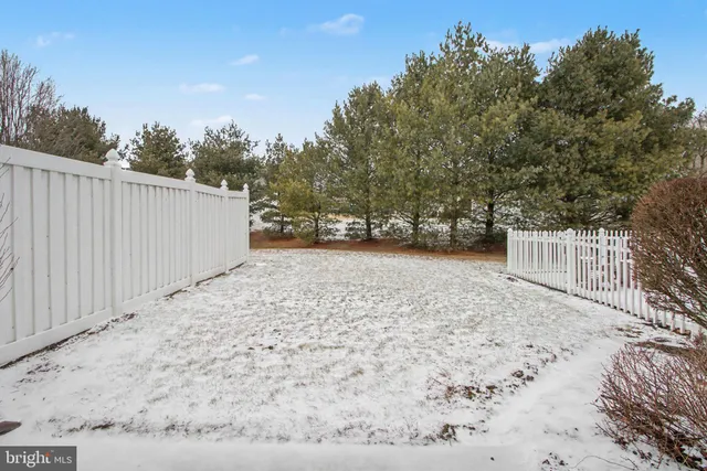 a view of a backyard with pathway