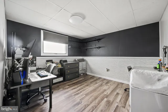 a kitchen with granite countertop a sink a stove and refrigerator