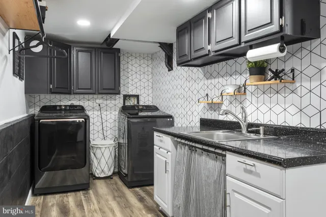 a view of a backyard with white fence