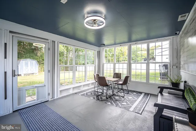 a view of a chairs and table in the patio