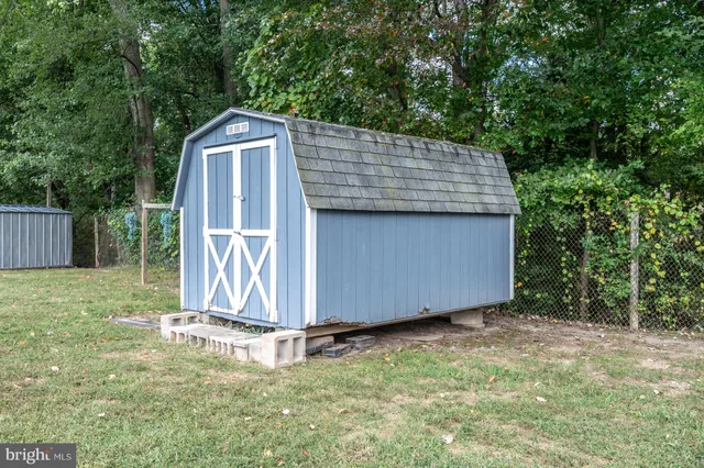 a big house with swimming pool in front of it