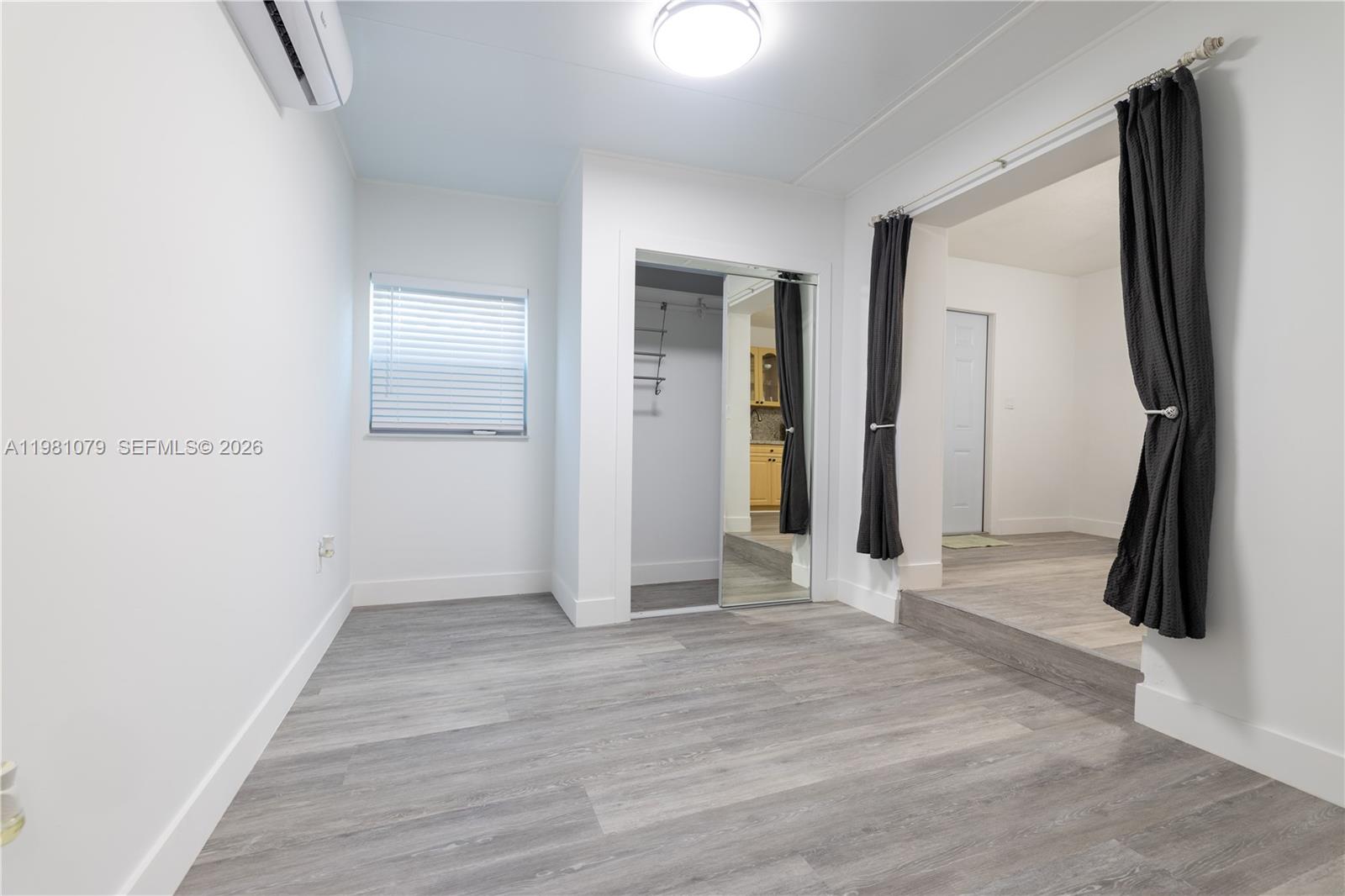 19600 Gulfstream Road Cutler Bay, FL 33157 - Photo 19 of 36 wooden floor in an empty room