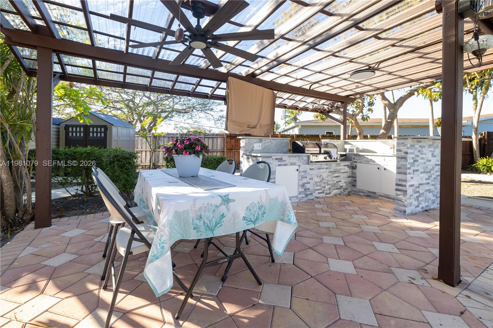 19600 Gulfstream Road Cutler Bay, FL 33157 - Photo 26 of 36 a view of a patio with a table and chairs