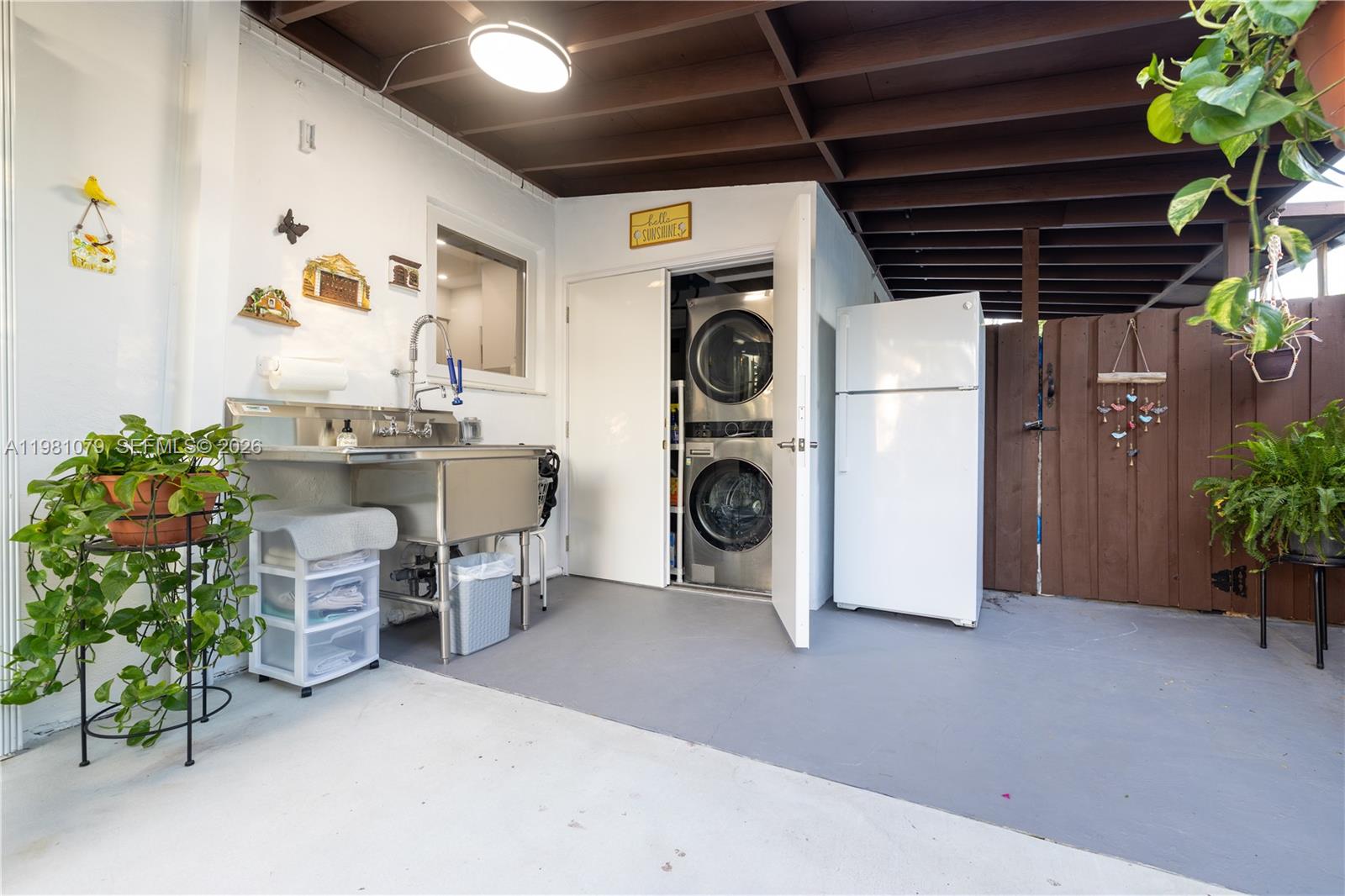19600 Gulfstream Road Cutler Bay, FL 33157 - Photo 33 of 36 a view of a storage & utility room with washer and dryer