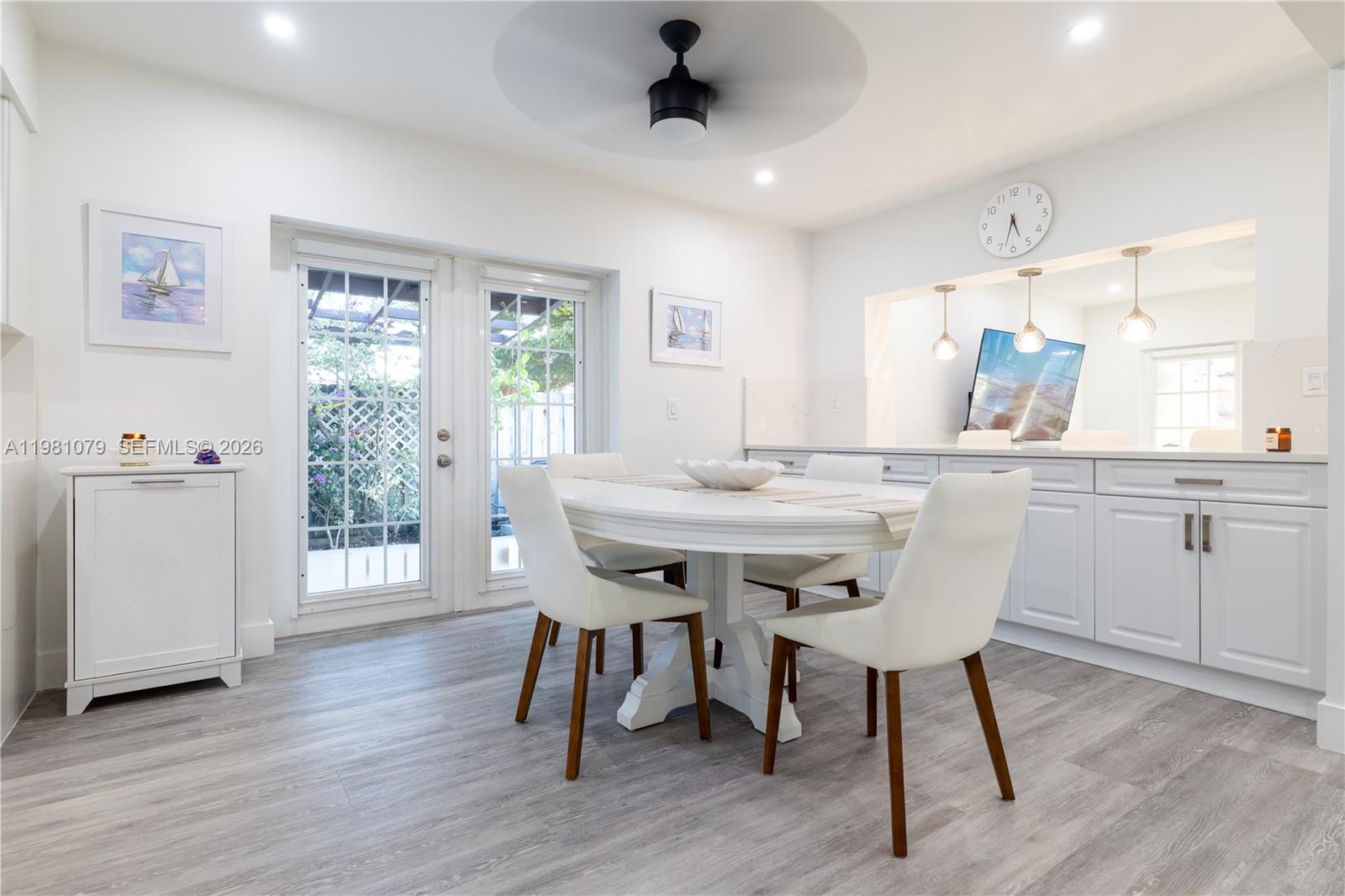 19600 Gulfstream Road Cutler Bay, FL 33157 - Photo 6 of 36 a view of a dining room with furniture window and wooden floor