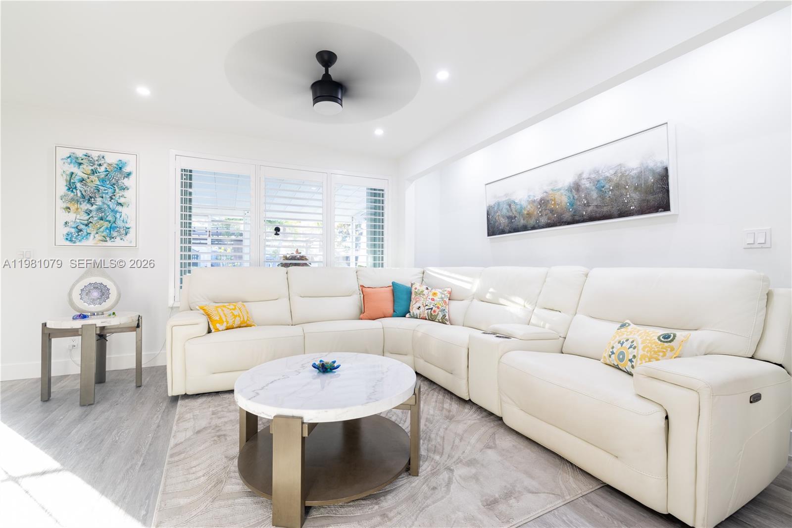 19600 Gulfstream Road Cutler Bay, FL 33157 - Photo 7 of 36 a living room with furniture and a large window