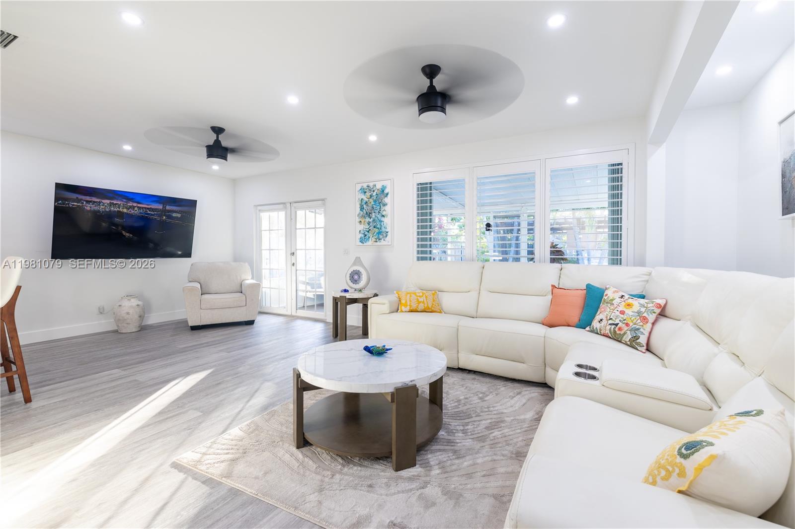 19600 Gulfstream Road Cutler Bay, FL 33157 - Photo 9 of 36 a living room with furniture and a flat screen tv