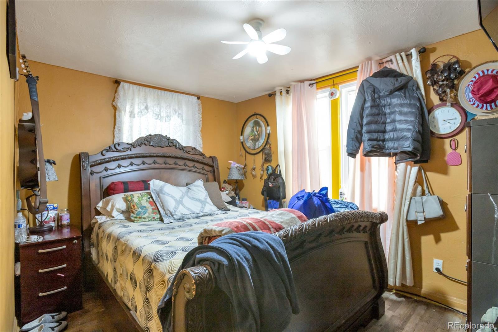 6830 Olive Street Commerce City, CO 80022 - Photo 12 of 25 a bedroom with a bed and a window