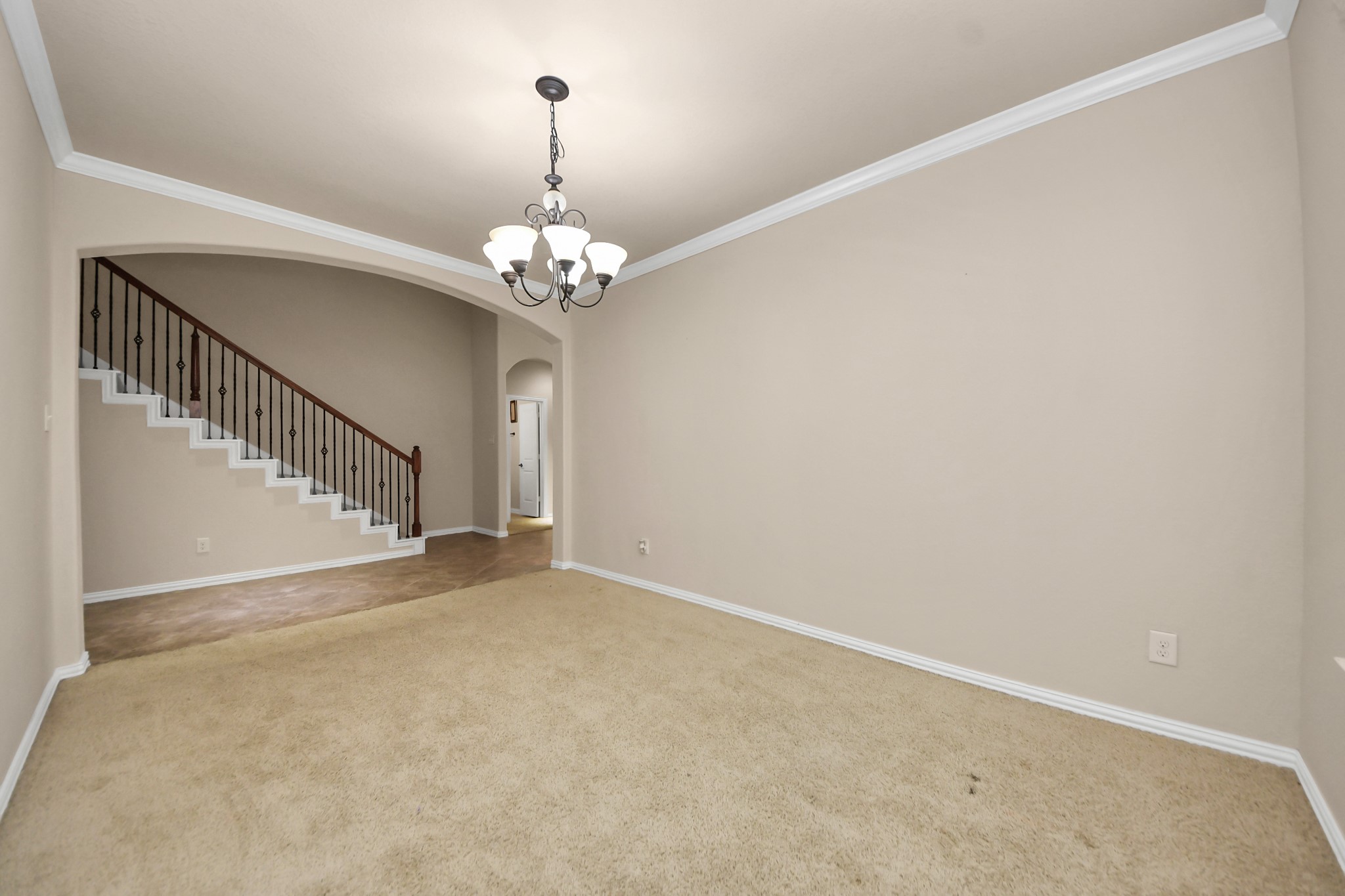 12131 Cove Ridge Lane Cypress, TX 77433 - Photo 11 of 46 wooden floor in an empty room with a chandelier