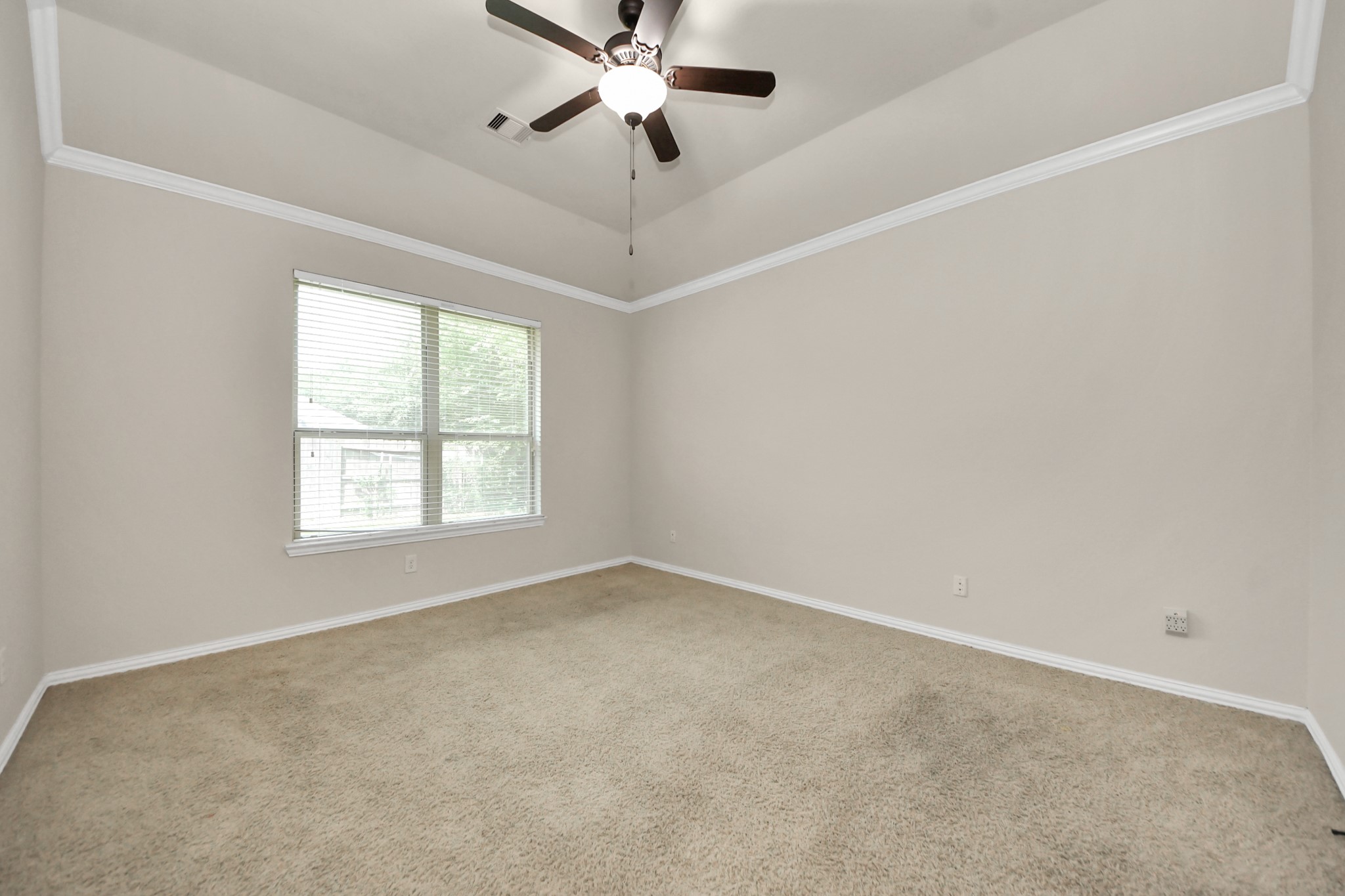 12131 Cove Ridge Lane Cypress, TX 77433 - Photo 26 of 46 an empty room with a window and a fan
