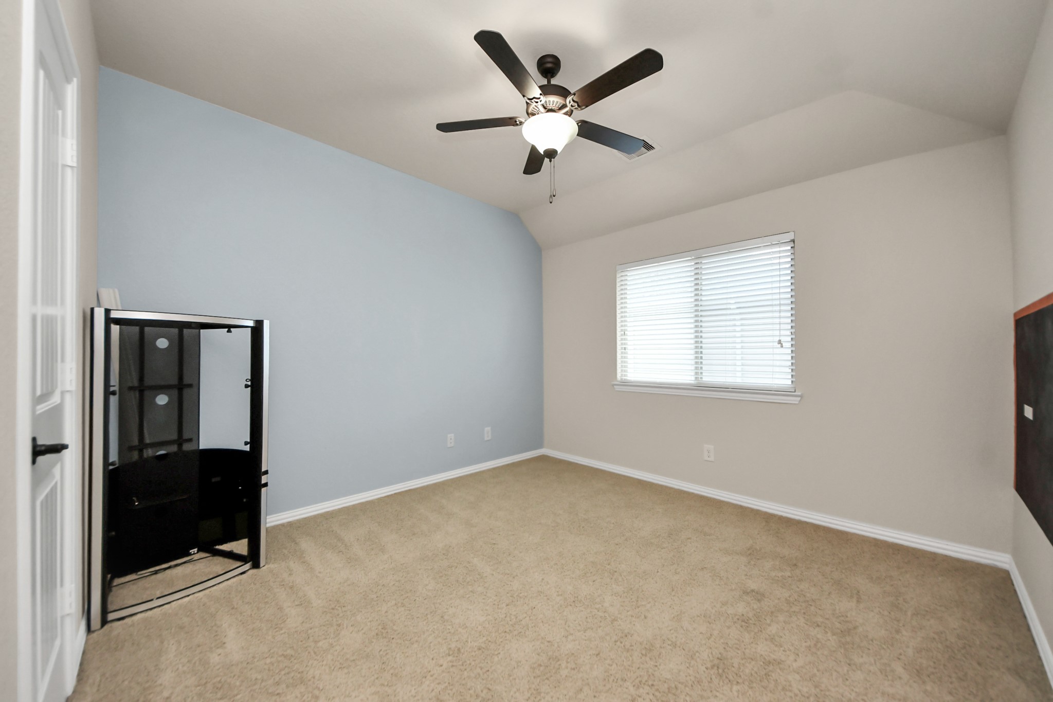 12131 Cove Ridge Lane Cypress, TX 77433 - Photo 38 of 46 an empty room with closet and windows