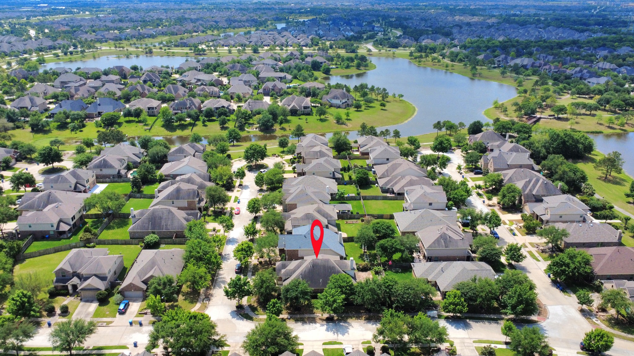 12131 Cove Ridge Lane Cypress, TX 77433 - Photo 45 of 46 an aerial view of lake and residential houses with outdoor space