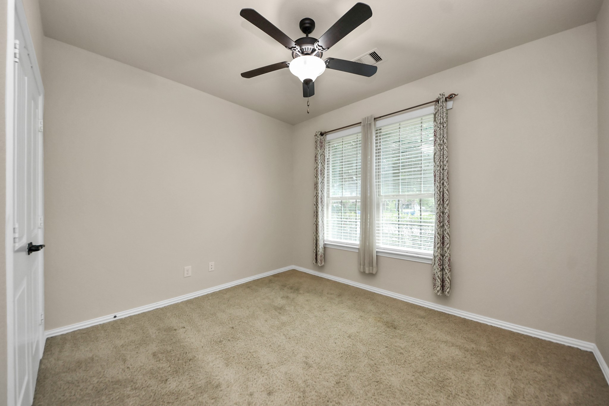 12131 Cove Ridge Lane Cypress, TX 77433 - Photo 6 of 46 a view of an empty room with a window