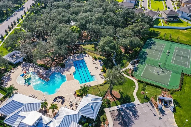 an aerial view of a house with outdoor space swimming pool and outdoor seating
