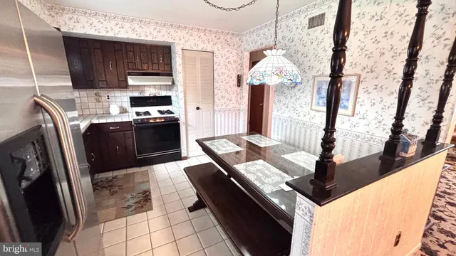 a view of a kitchen from a dining room