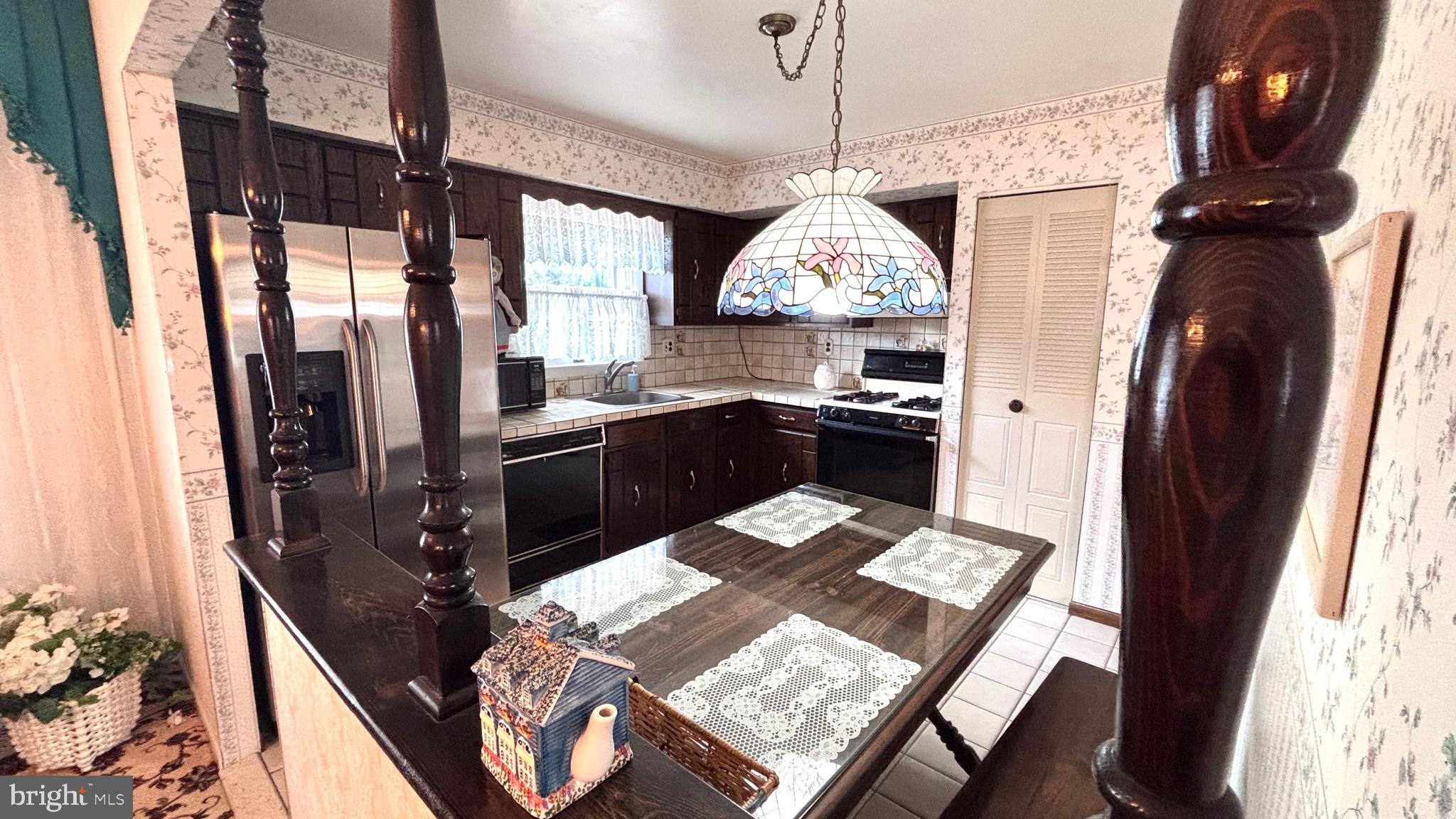9401 Tulip Street Philadelphia, PA 19114 - Photo 16 of 67 a view of a kitchen from a dining room