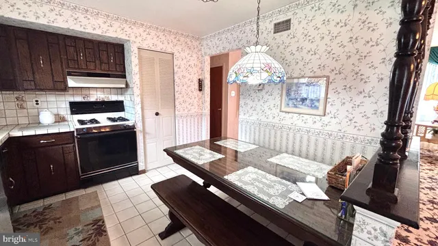 a bathroom with a sink a toilet and window