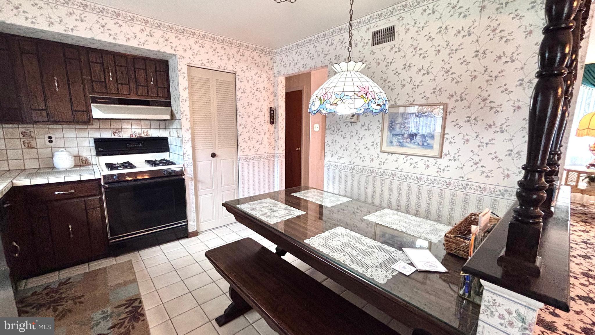 9401 Tulip Street Philadelphia, PA 19114 - Photo 18 of 67 a kitchen with a stove and a sink