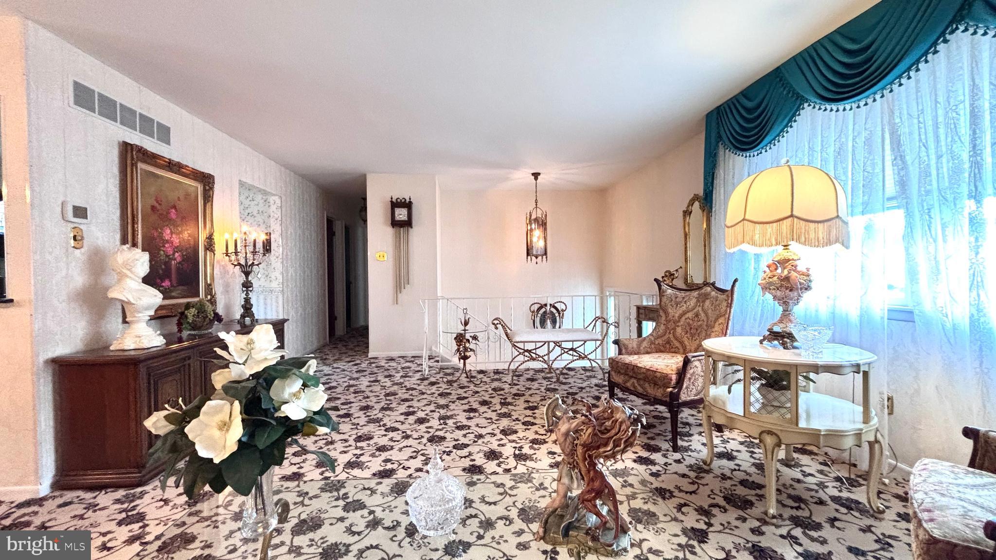 9401 Tulip Street Philadelphia, PA 19114 - Photo 2 of 67 a living room with furniture and a large window