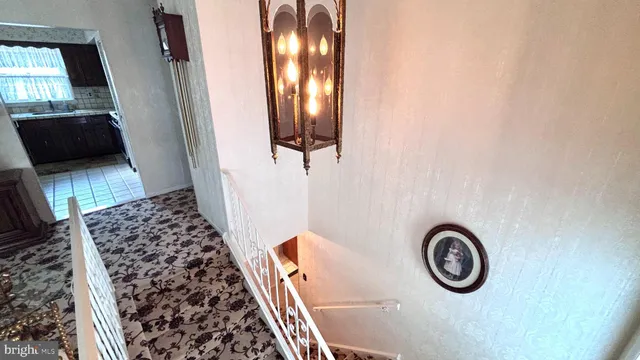 a living room with furniture and a lamp