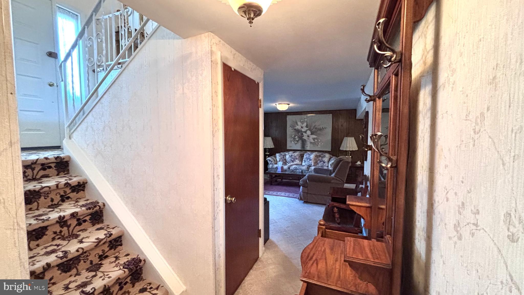 9401 Tulip Street Philadelphia, PA 19114 - Photo 26 of 67 a view of living room with furniture and a floor to ceiling window