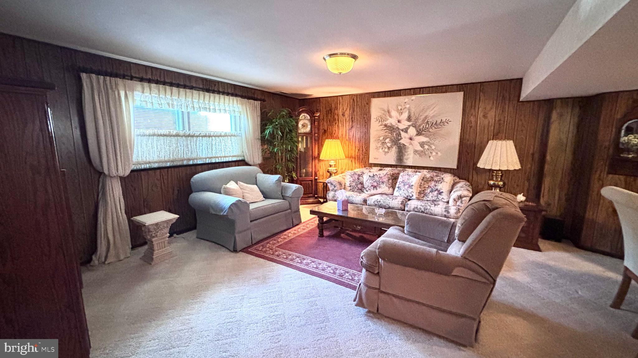 9401 Tulip Street Philadelphia, PA 19114 - Photo 27 of 67 a living room with furniture and a large window