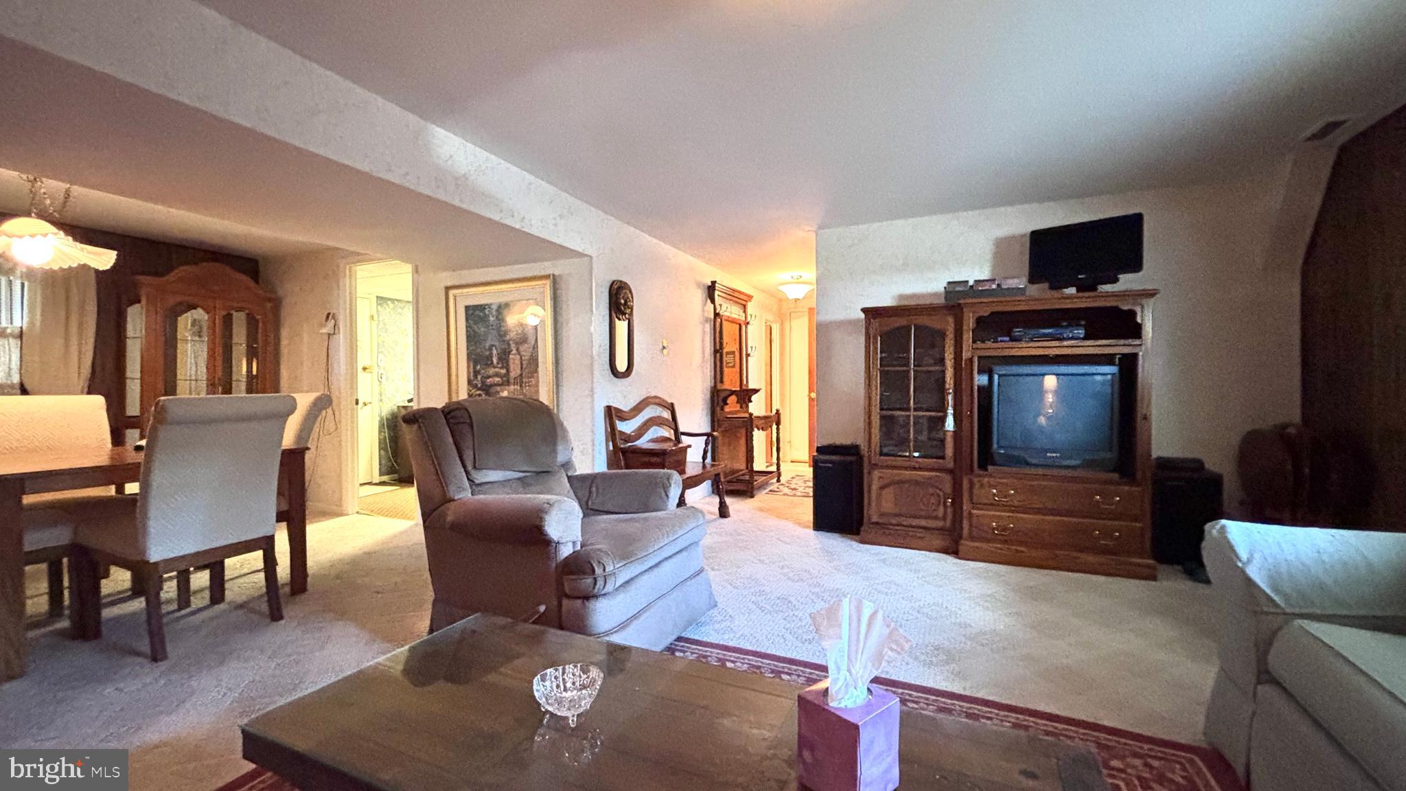 9401 Tulip Street Philadelphia, PA 19114 - Photo 28 of 67 a living room with furniture and a flat screen tv