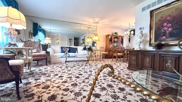a living room with furniture a rug and a fireplace