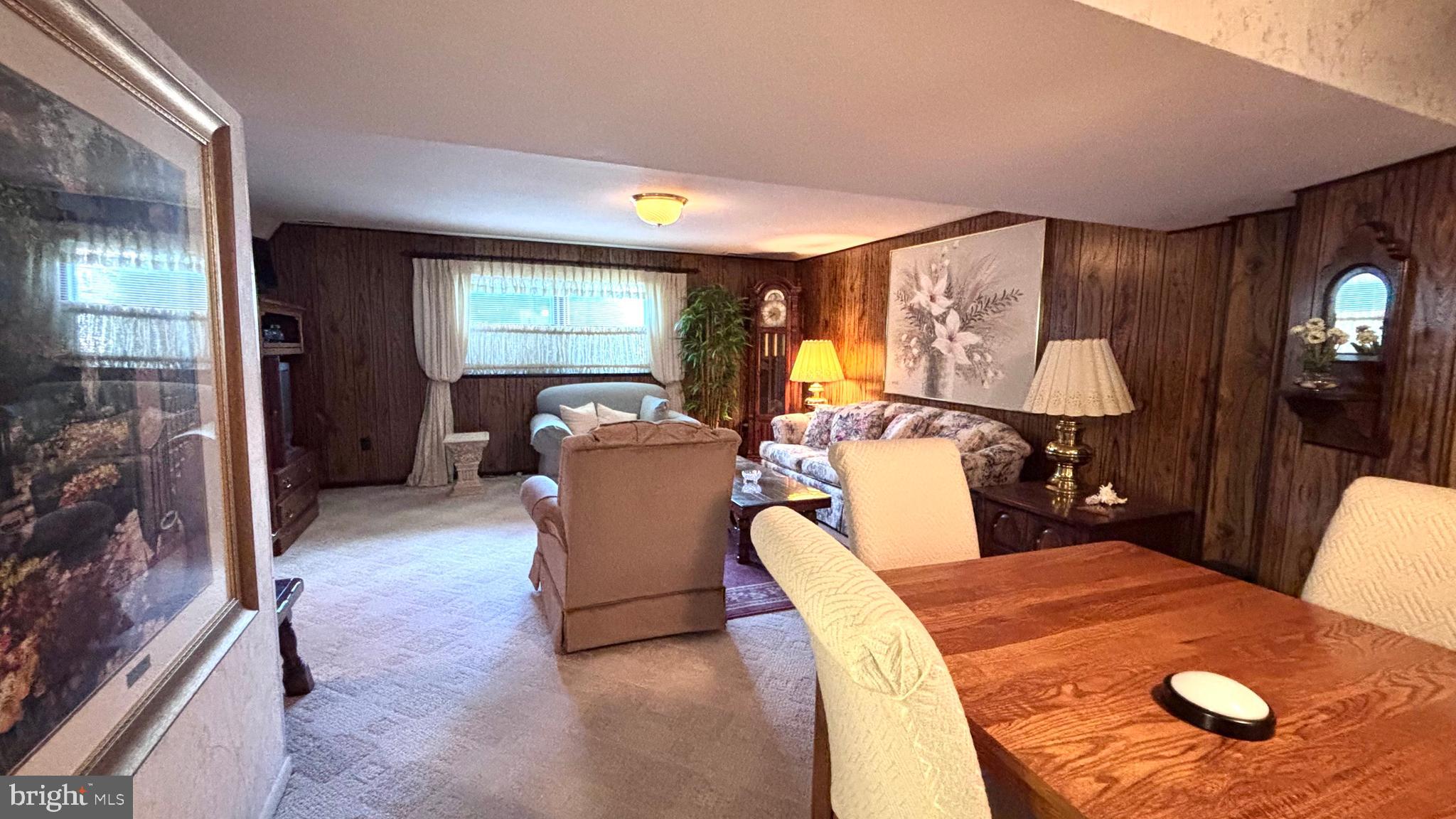 9401 Tulip Street Philadelphia, PA 19114 - Photo 34 of 67 a living room with furniture a lamp and large window