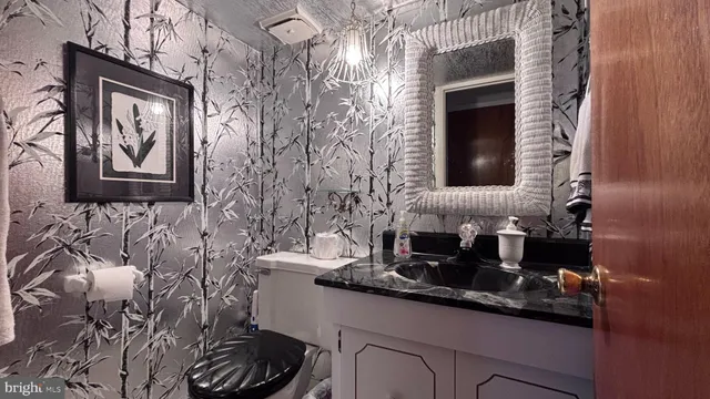 a bedroom with a large bed and a dresser