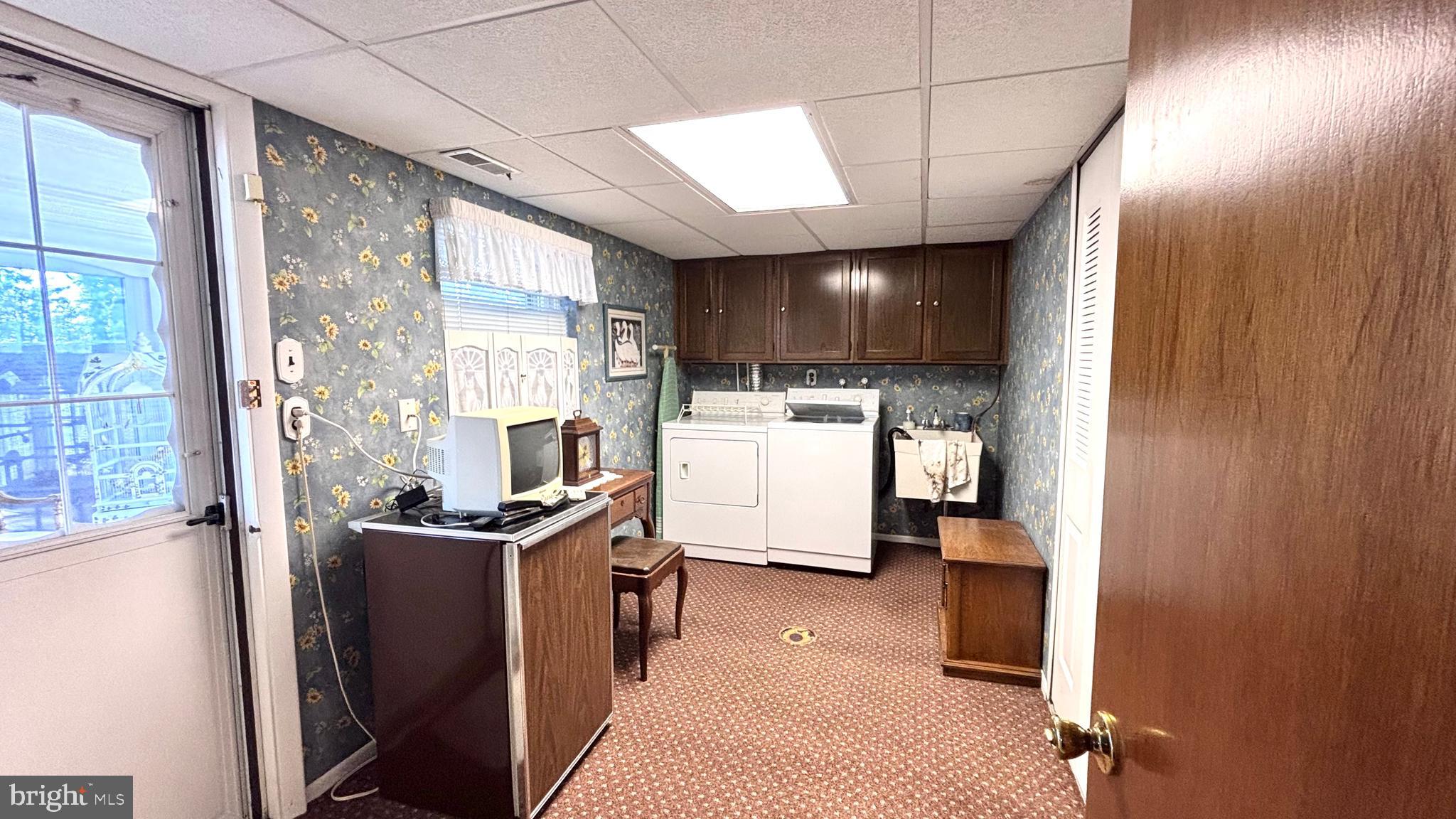 9401 Tulip Street Philadelphia, PA 19114 - Photo 38 of 67 a kitchen with stainless steel appliances granite countertop a refrigerator a sink dishwasher a stove and a dining table with wooden floor