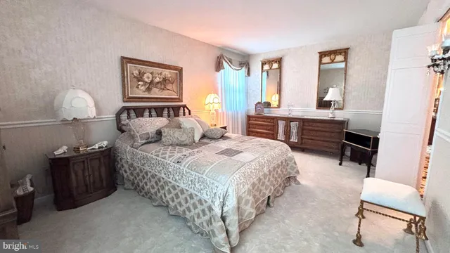 a view of living room with furniture and a floor to ceiling window