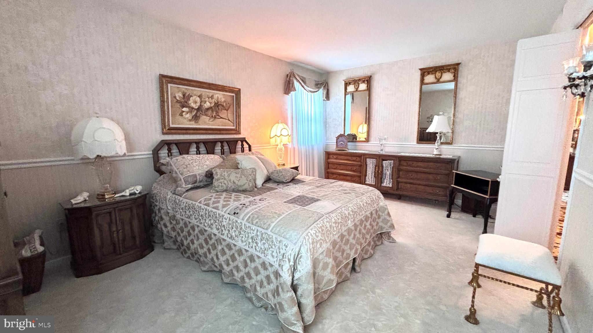 9401 Tulip Street Philadelphia, PA 19114 - Photo 45 of 67 a bedroom with a bed and a table in it