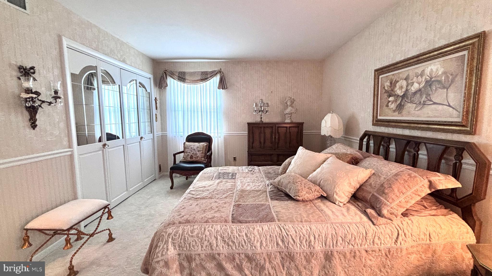 9401 Tulip Street Philadelphia, PA 19114 - Photo 48 of 67 a bedroom with a bed and wooden floor