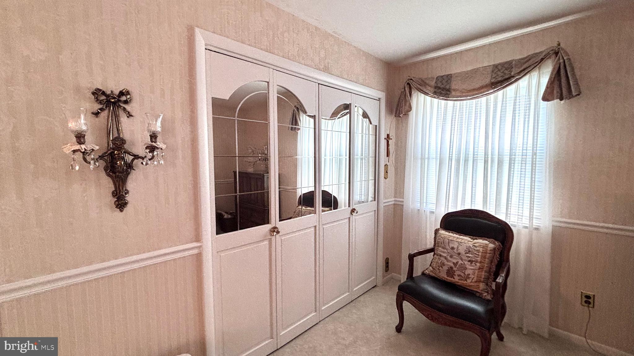 9401 Tulip Street Philadelphia, PA 19114 - Photo 49 of 67 a living room with furniture and a window