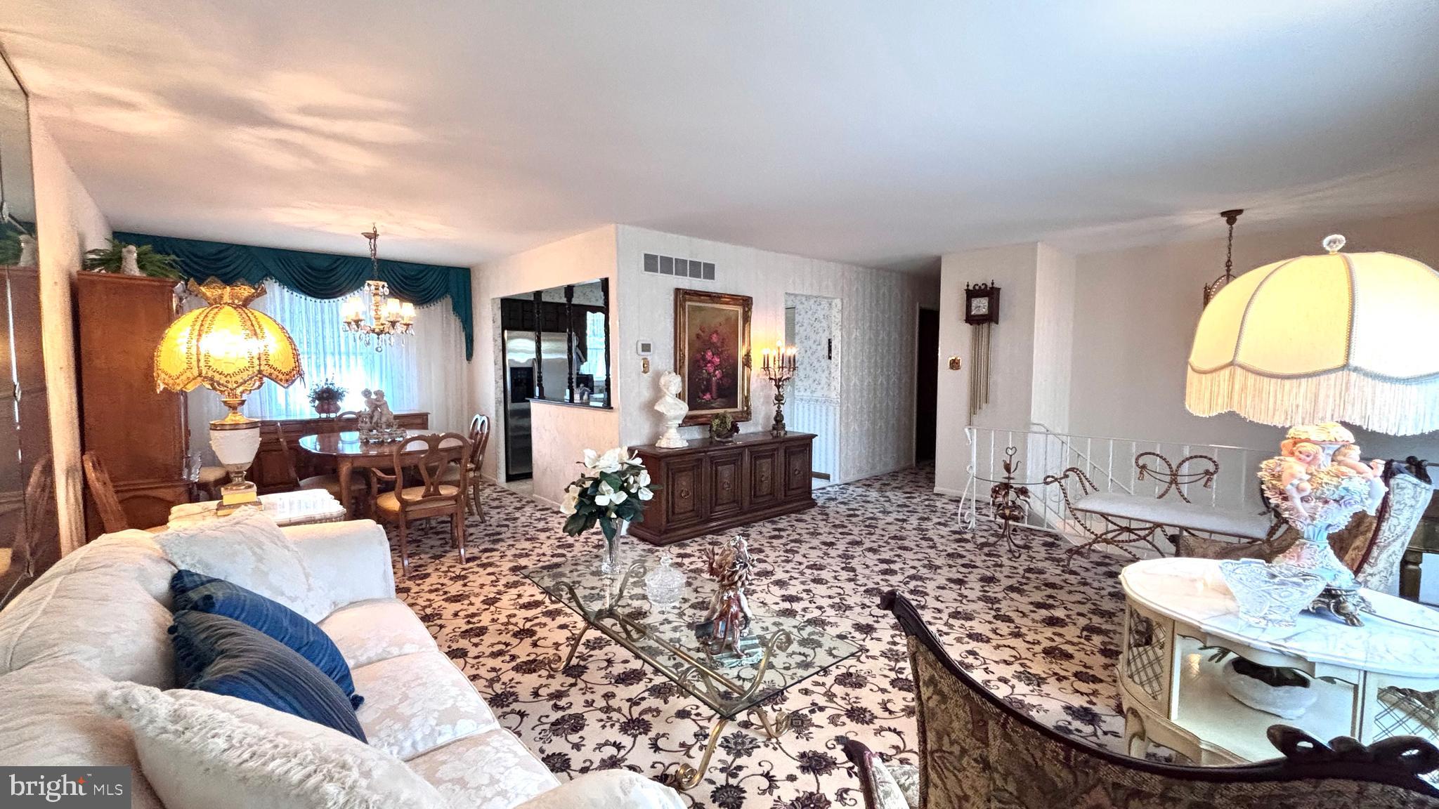 9401 Tulip Street Philadelphia, PA 19114 - Photo 5 of 67 a living room with furniture and a chandelier