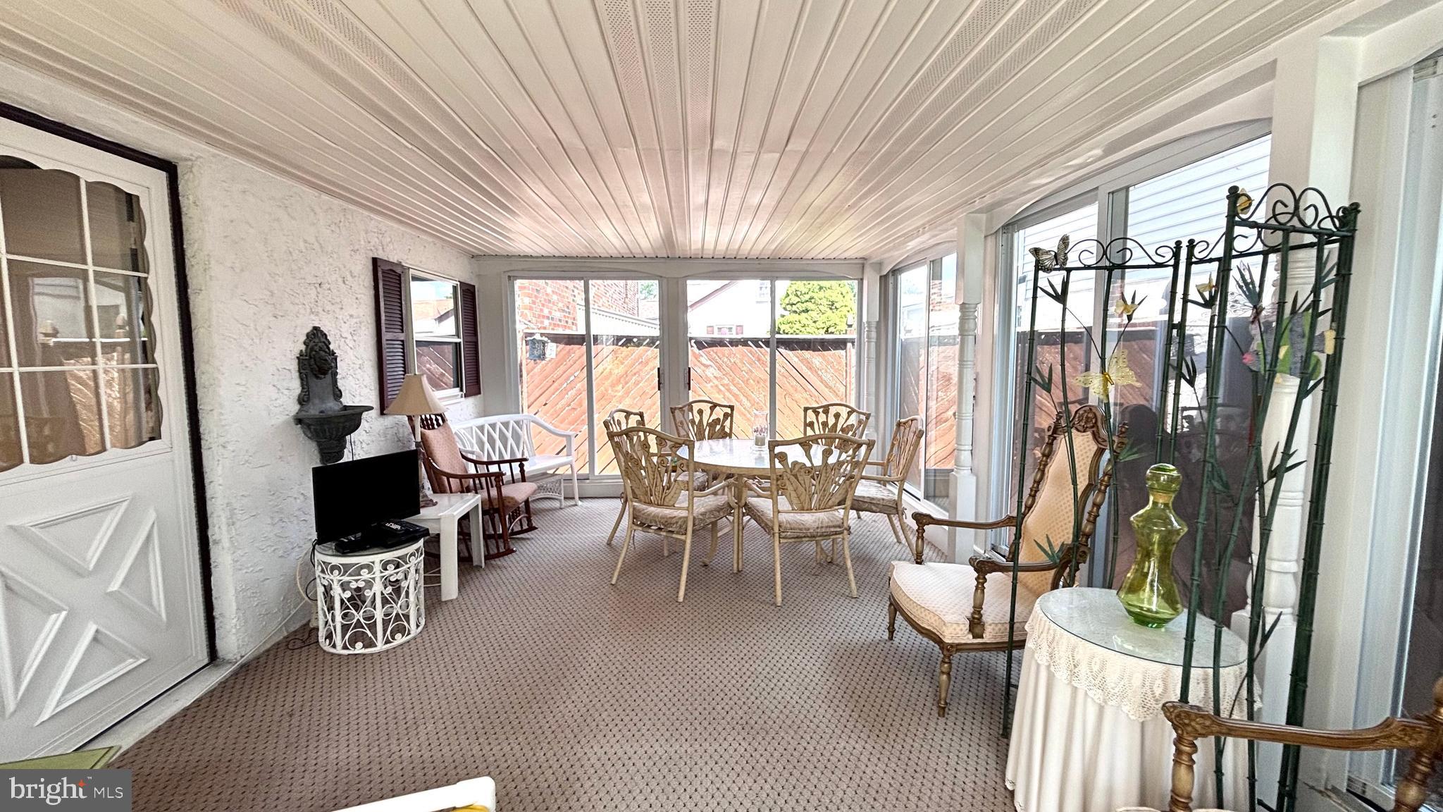 9401 Tulip Street Philadelphia, PA 19114 - Photo 53 of 67 a living room with furniture and large windows