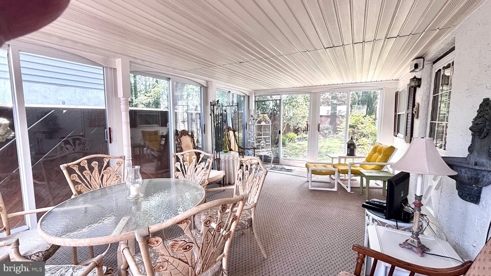 9401 Tulip Street Philadelphia, PA 19114 - Photo 54 of 67 a dining room with furniture large windows and wooden floor
