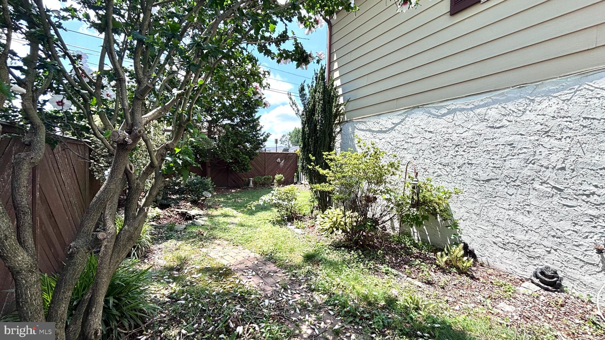 9401 Tulip Street Philadelphia, PA 19114 - Photo 61 of 67 a backyard of a house with lots of green space