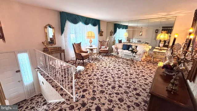 a living room with furniture and a rug