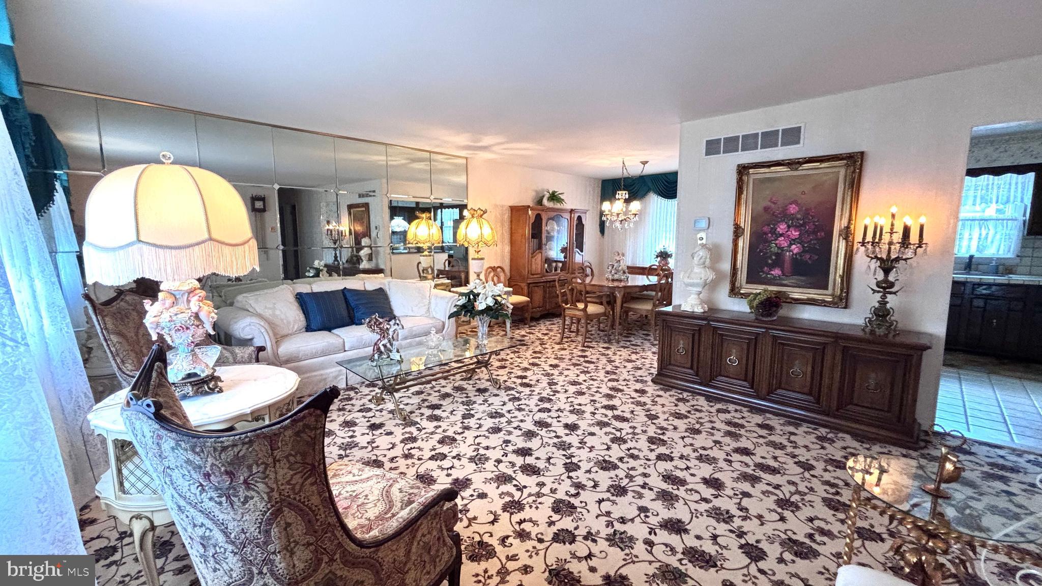 9401 Tulip Street Philadelphia, PA 19114 - Photo 8 of 67 a living room with furniture a large window and a table